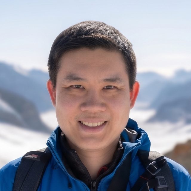Chris Cheng smiling in the mountains
